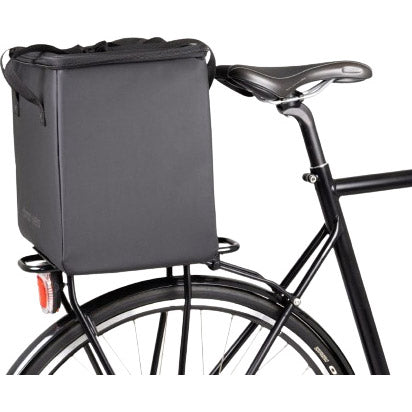 Black Atranvelo koeltas cooling bag attached to a bicycle rack, featuring a rectangular shape and handle.