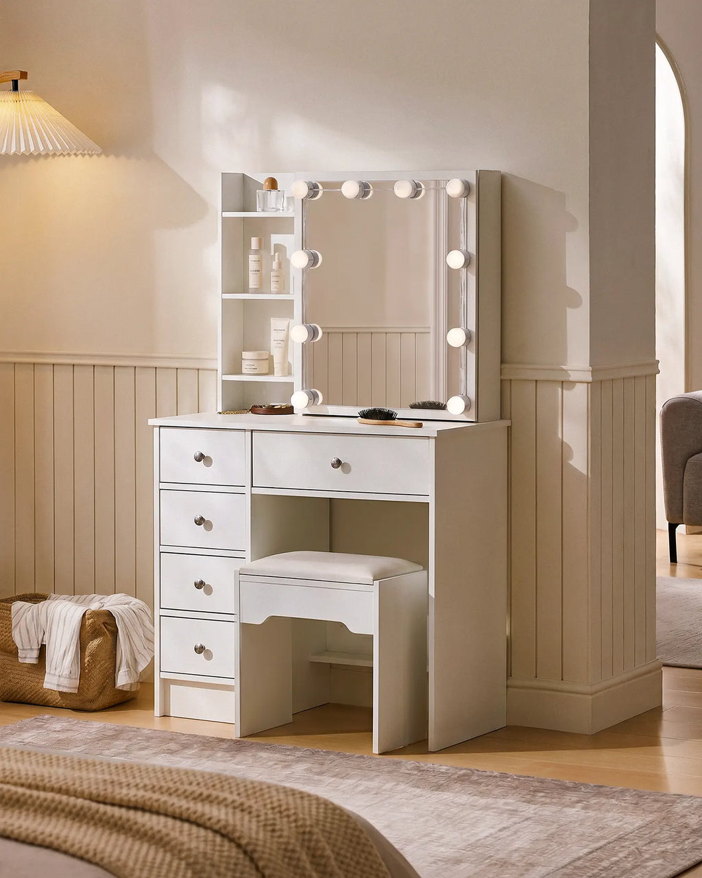 White Amya Dressing Table set with sliding mirror, LED bulbs, five drawers, and a padded stool. Ideal for organized beauty essentials.