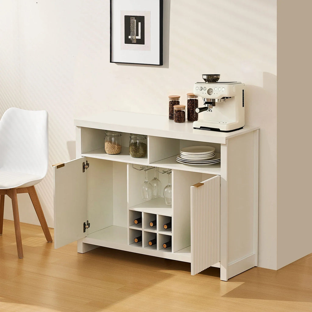 Warm white Arden Wine Bar Cabinet featuring fluted panel doors and brushed gold handles, with open shelves and wine rack.