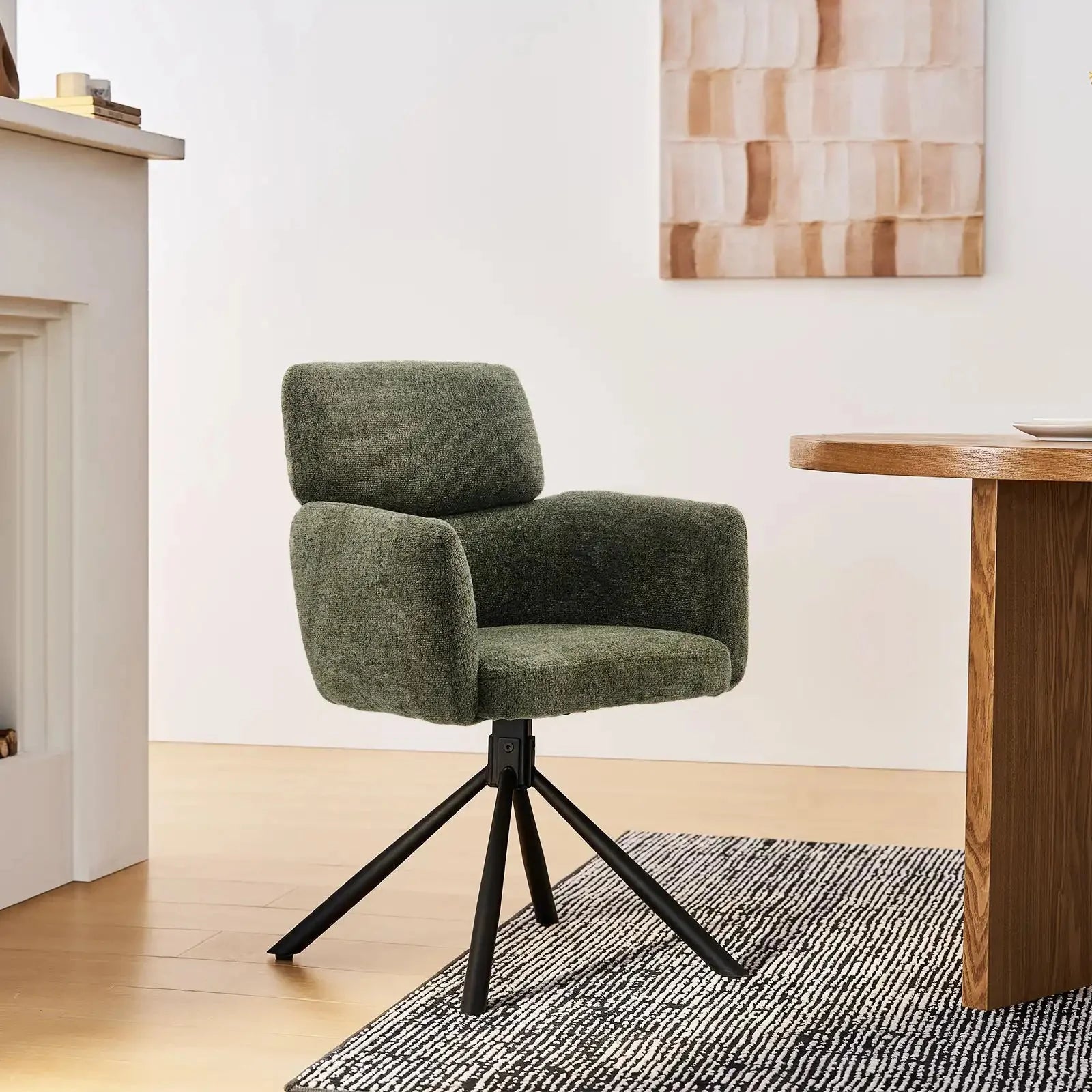 Chenille swivel chair in olive green with black metal base, featuring a modern design and comfortable armrests.