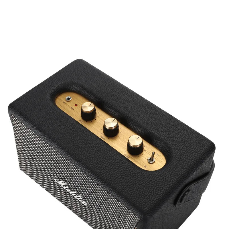 Retro Bluetooth speaker with black textured body, wooden finish controls, and front speaker grille.