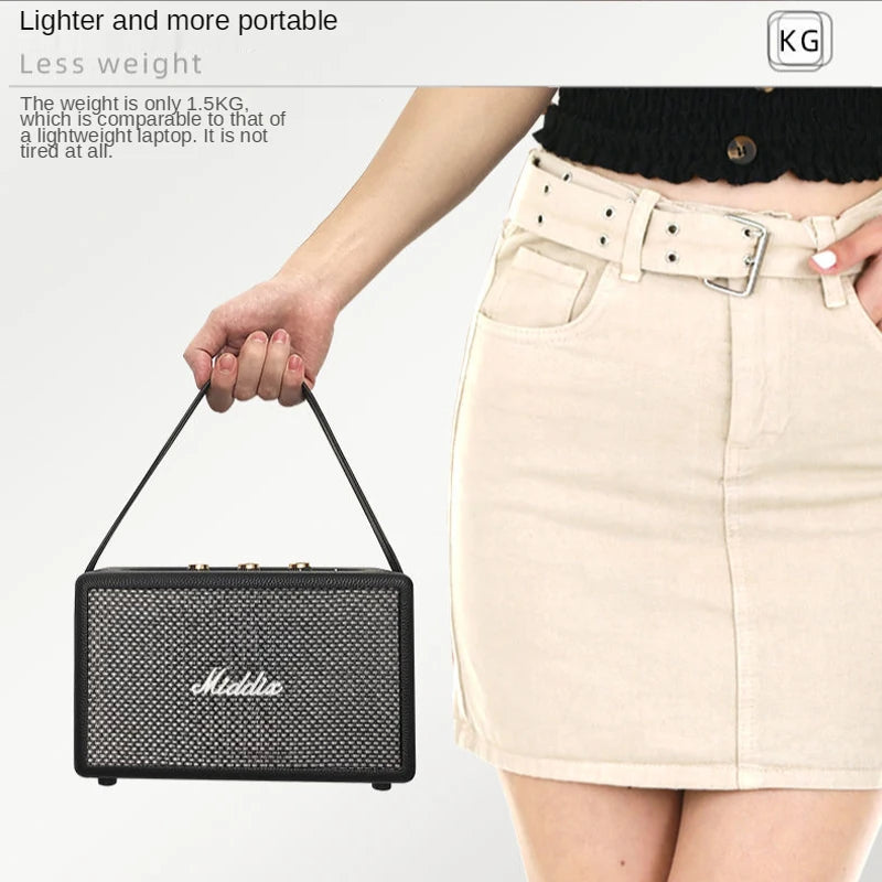 Portable Retro Bluetooth Speaker with wooden finish, held in a hand, featuring a carrying strap and metallic detailing.