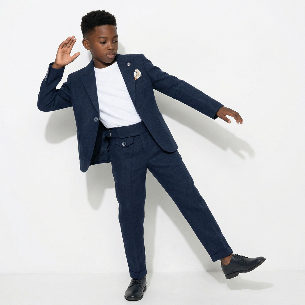 Navy blue formal suit for boys featuring a structured blazer, tailored trousers, and a white undershirt, styled playfully.