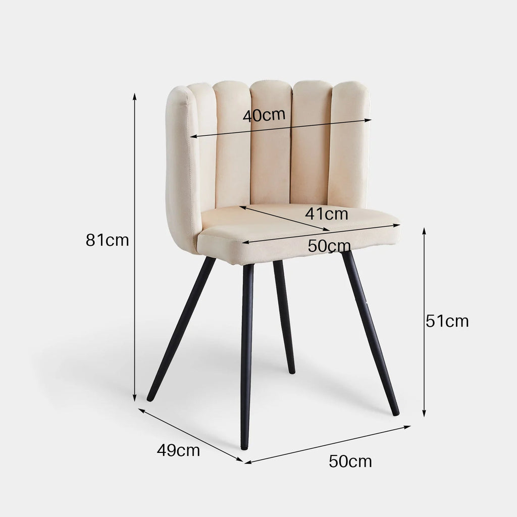 Petal-shaped velvet dining chair in beige with a tufted backrest and tapered black metal legs, featuring a wide seat.