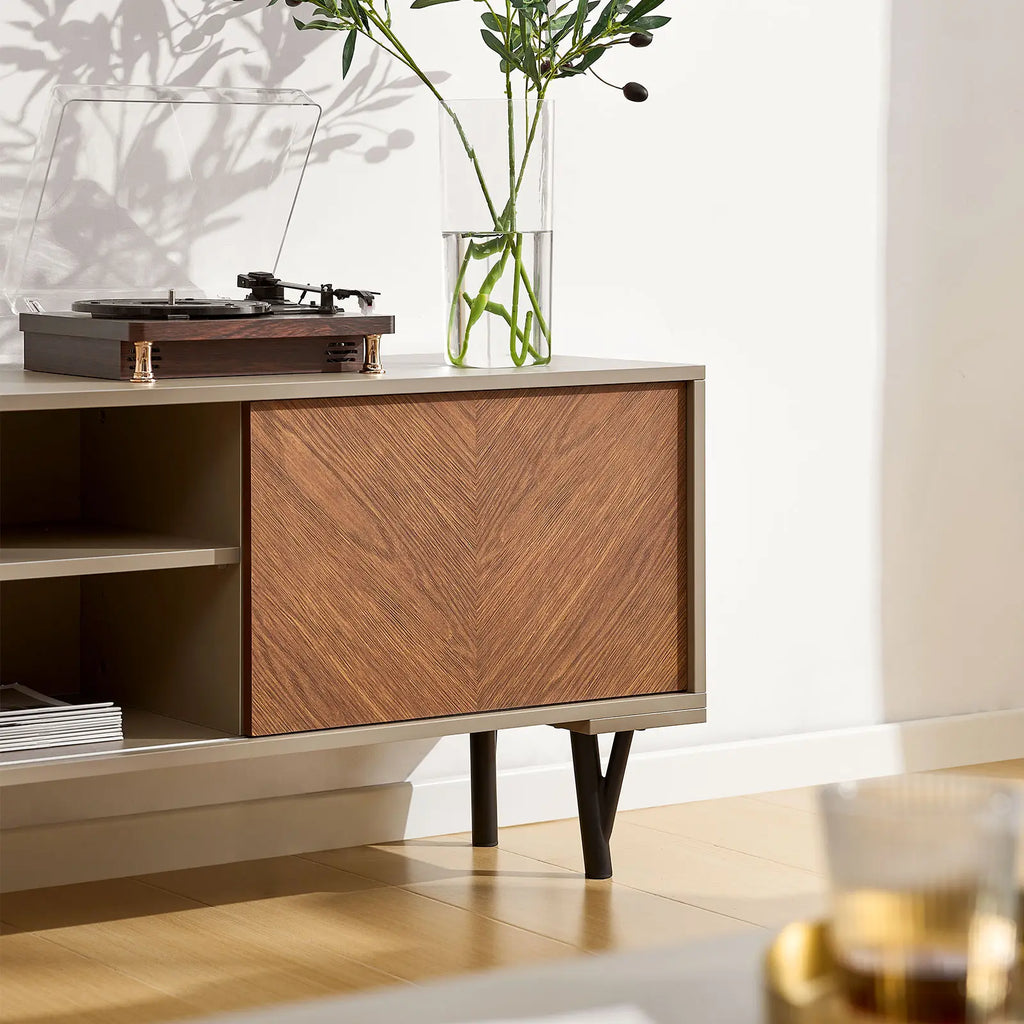 Walnut and sand beige Milano Extendable TV stand with herringbone patterned drawer, open shelves, and sleek black legs.