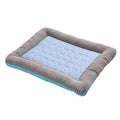 Cooling pet pad with a light blue quilted center and gray striped edges, suitable for pets to stay comfortable.