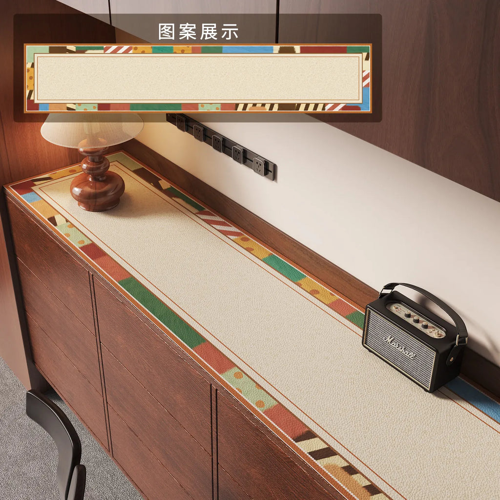 Vintage cartoon-inspired cabinet mat protector featuring colorful borders, placed on a wooden TV stand, with a lamp and speaker beside it.
