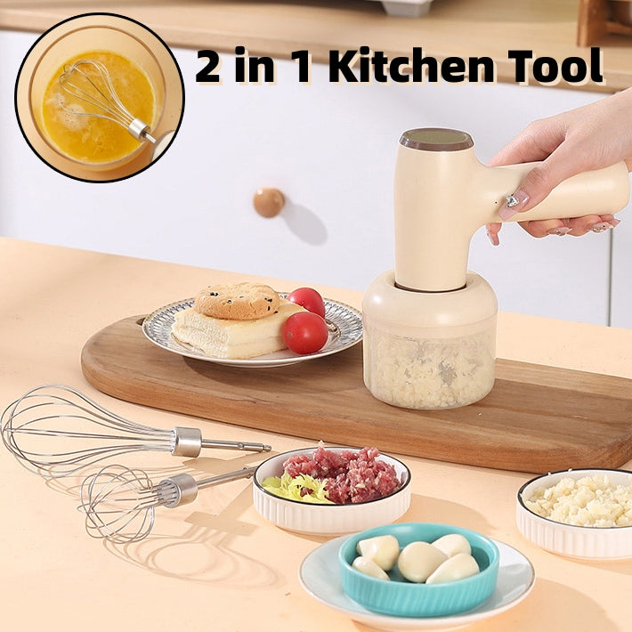 Khaki USB rechargeable garlic chopper with a handheld design, accompanied by mixing whisks and bowls of chopped ingredients on a kitchen countertop.
