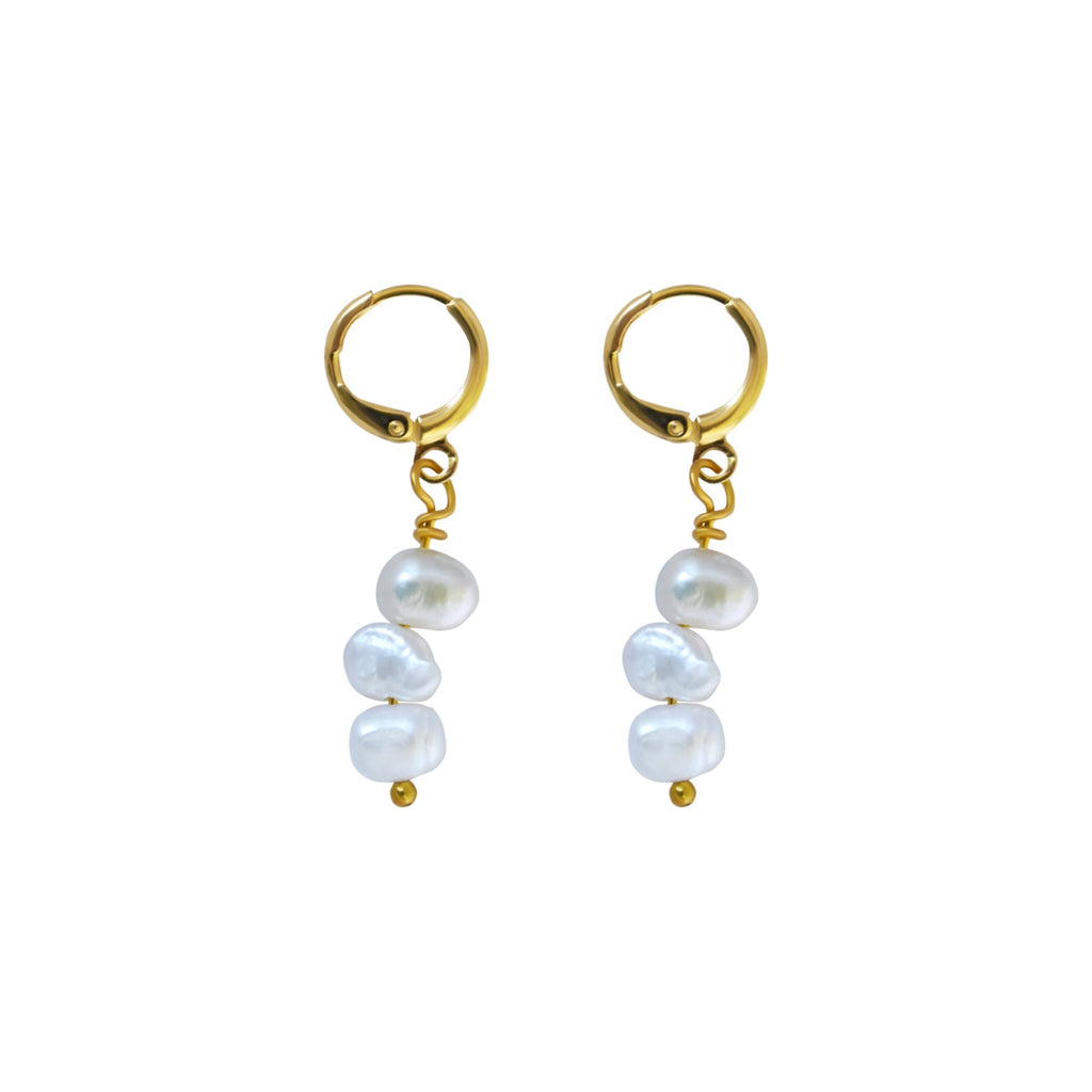 Triple irregular white freshwater pearl earrings with gold-plated brass huggies, hanging below an inch.